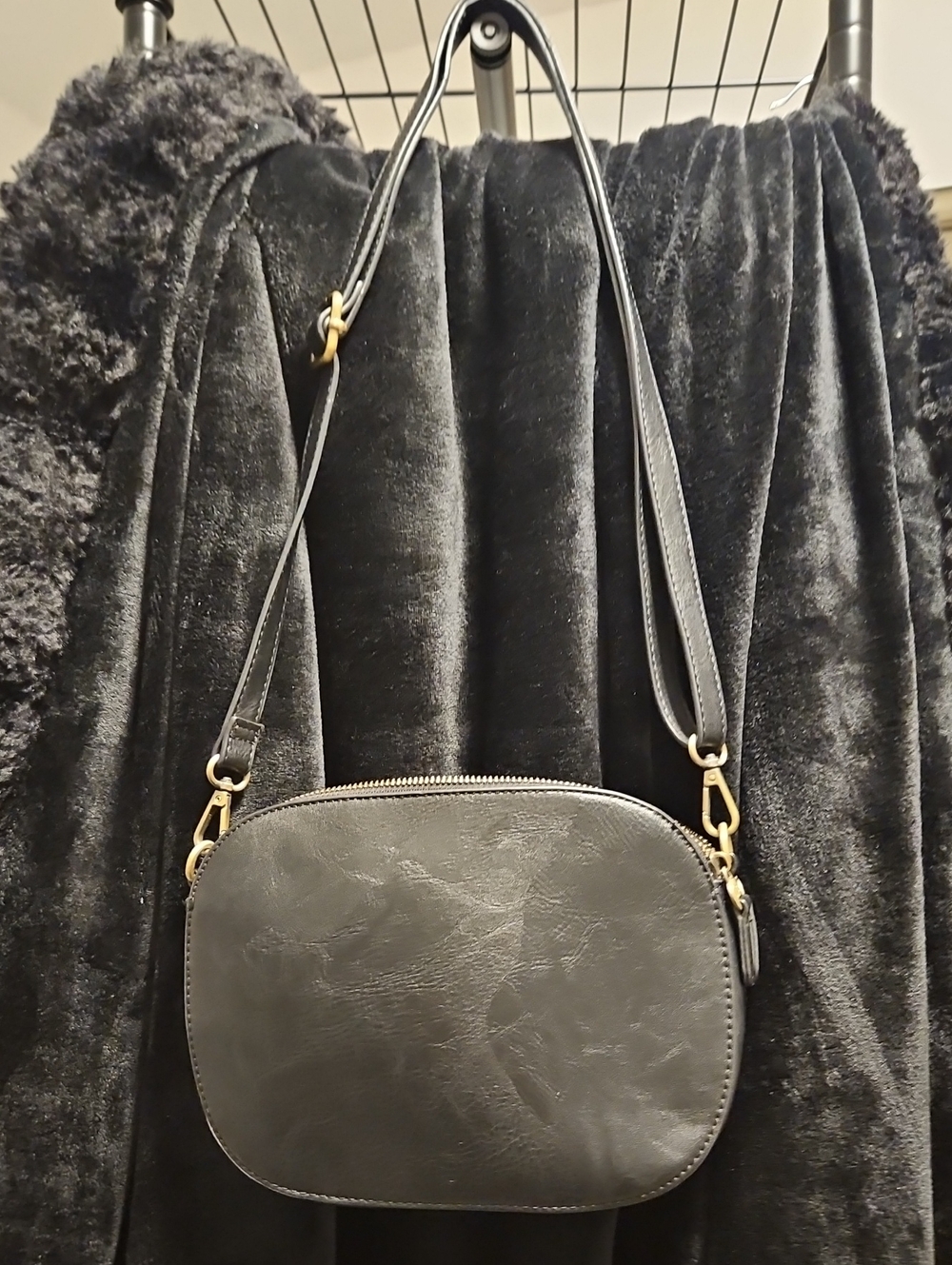Joy Susan Black Oval Leather Crossbody Bag with Gold Hardware